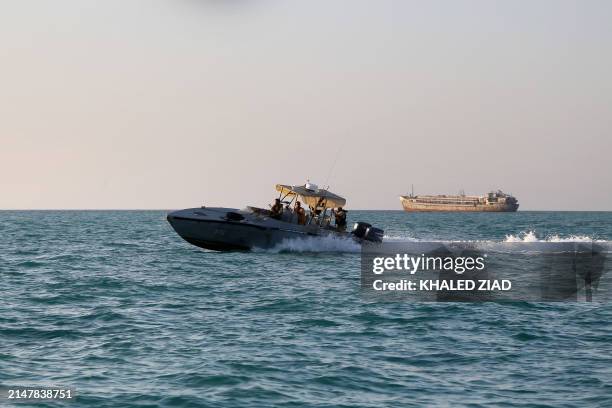Yemeni coastguards loyal to the internationally-recognised government ride in a patrol boat in the Red Sea off the government-held town of Mokha in...
