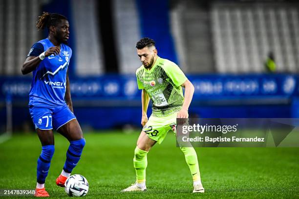 Arial MENDY of Grenoble and Farid EL MELALI of Angers during the Ligue 2 BKT match between Grenoble and Angers at Stade des Alpes on April 15, 2024...