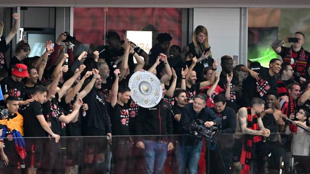 Bayer 04 Leverkusen coach Xabi Alonso shows the supporters the Meisterschale during the Bundesliga match between Bayer 04 Leverkusen and Werder...