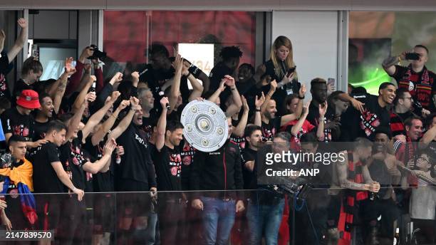 Bayer 04 Leverkusen coach Xabi Alonso shows the supporters the Meisterschale during the Bundesliga match between Bayer 04 Leverkusen and Werder...