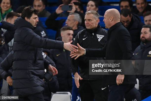 Chelsea's Argentinian head coach Mauricio Pochettino and Everton's English manager Sean Dyche shake hands after the English Premier League football...