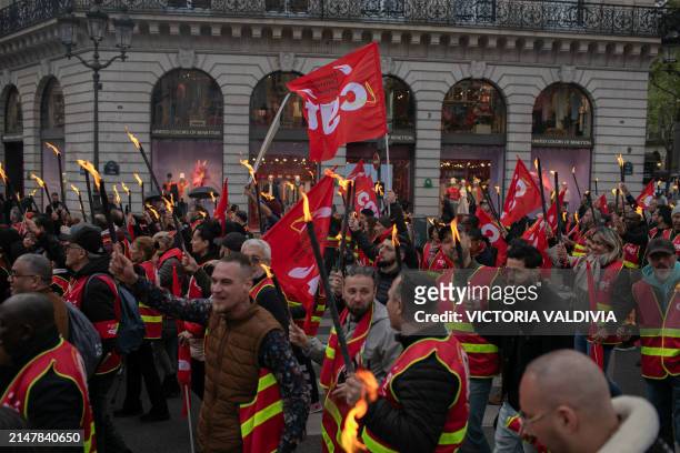 Unions demonstrators with torchlights at the CGT union torchlight march in Paris, France on April 15, 2024. The French union announced this...