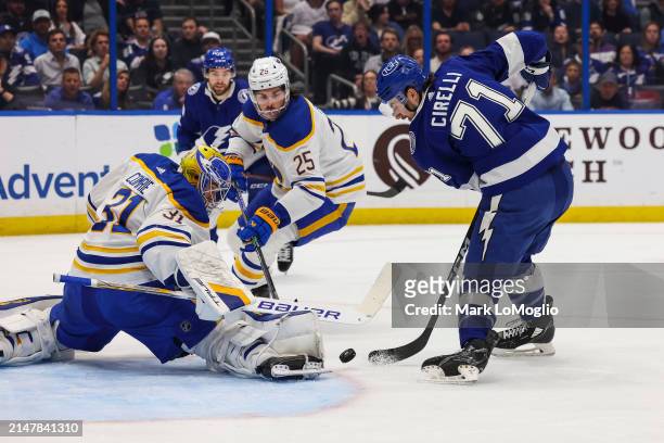 Anthony Cirelli of the Tampa Bay Lightning looks for a rebound against goalie Eric Comrie of the Buffalo Sabres during the first period at Amalie...