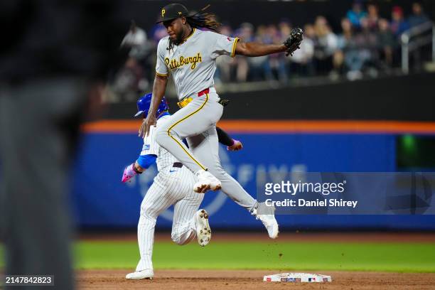 Harrison Bader of the New York Mets is forced out at second base after Oneil Cruz of the Pittsburgh Pirates fields a ball in the sixth inning of the...