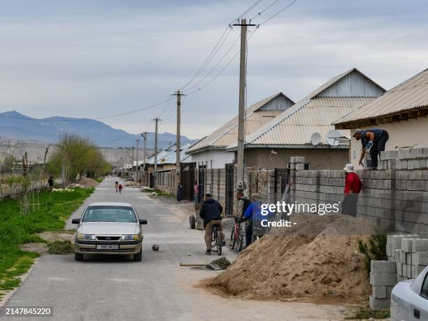 New homes are under construction in the village of Khuroson, near Obikiik, some 70 kilometers south of the capital Dushanbe, on March 26, 2024. "We...