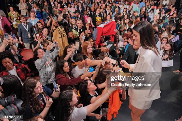 Caitlin Clark signs autographs before the 2024 WNBA Draft on April 15, 2024 at the Brooklyn Academy of Music in Brooklyn, New York. NOTE TO USER:...