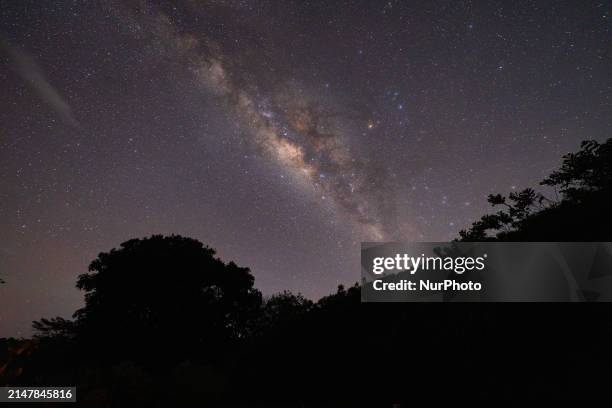 The Milky Way is being seen over the mountain in Ratnapura, Sri Lanka, on April 16, 2024. In April 2024, skywatchers are anticipating a trio of...