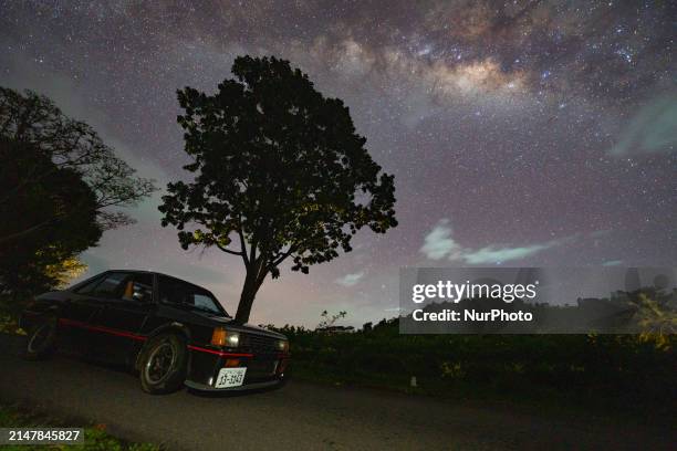 Mitsubishi Lancer Box car, made in 1979, is seen with the Milky Way over the mountain in Ratnapura, Sri Lanka, on April 16, 2024. In April 2024,...