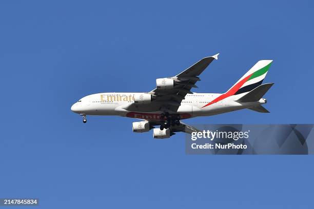 An Emirates Airbus A380 is flying over Christchurch, New Zealand, on April 14, 2024.