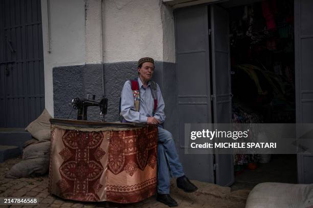 Tailor waits outside his shop inside the walled city of Harar on April 15, 2024. Founded in the 10th century, Harar - also called Jugol - is reputed...