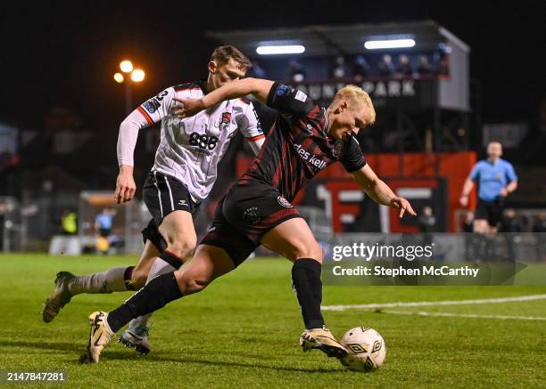 Dublin , Ireland - 15 April 2024; Michael Lilander of Bohemians in action against Zak Bradshaw of Dundalk during the SSE Airtricity Men's Premier...