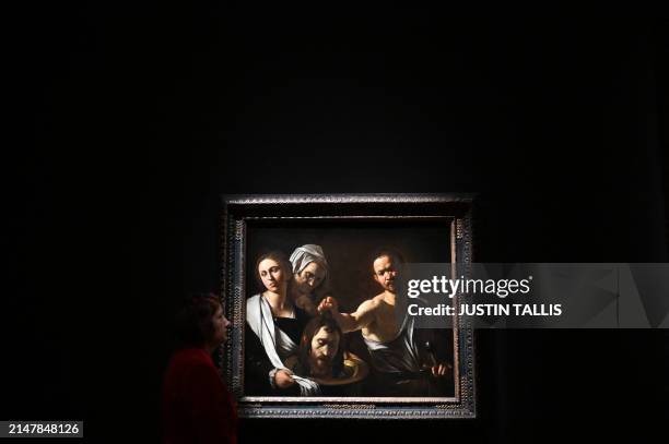 An artwork entitled "Salome receives the Head of John the Baptist" by Italian artist Michelangelo Merisi da Caravaggio is pictured during a photocall...