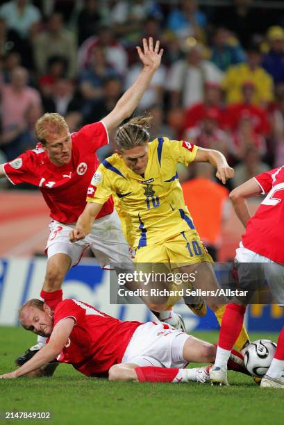 June 26: Stephane Grichting of switzerland, Andrij Voronin of Ukraine and Ludovic Magnin of Switzerland challenge during the FIFA World Cup Finals...