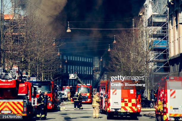 Smoke from a fire at Borsen, Denmark's old stock exchange building, in Copenhagen, Denmark, on Tuesday, April 16, 2024. The fire has torn down the...