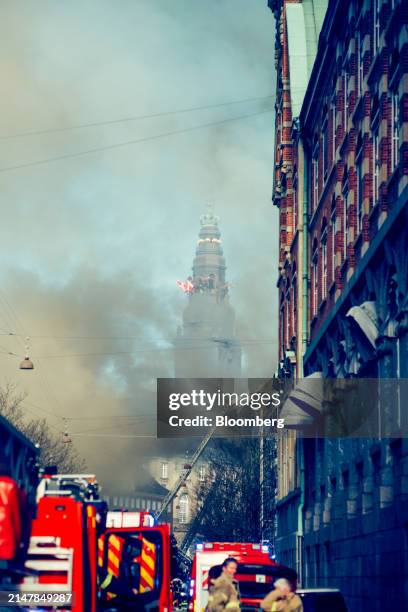Firefighters tackle a fire at Borsen, Denmark's old stock exchange building, in Copenhagen, Denmark, on Tuesday, April 16, 2024. The fire has torn...