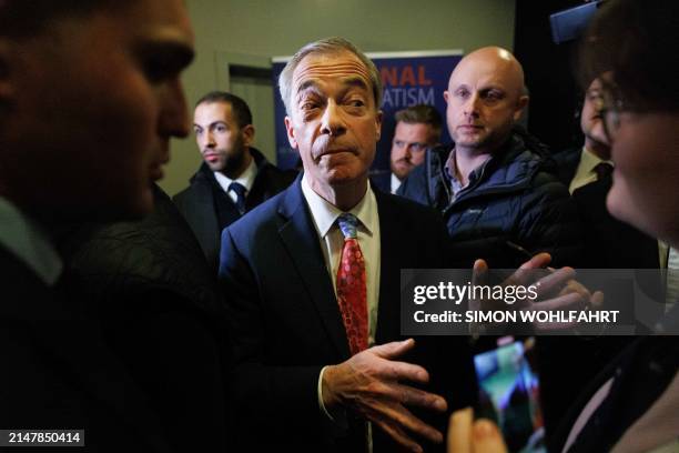 British eurosceptic populist Nigel Farage speaks to journalists at the "NatCon" national conservatism conference gathering hard-right politicians in...
