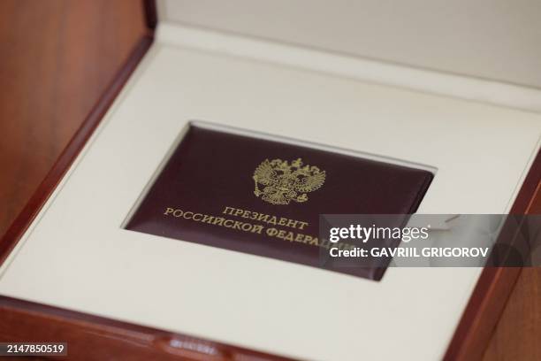 This pool photograph distributed by Russian state owned agency Sputnik, shows the certificate of election as the President of the Russian Federation,...