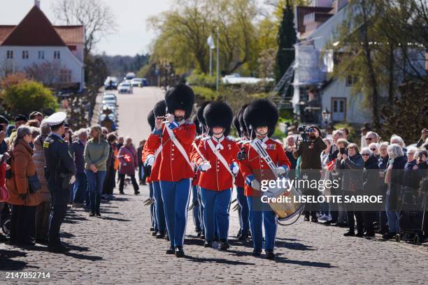 Royal Life Guards march in front of Fredensborg Castle during festivities to celebrate the 84th birthday of Margrethe II of Denmark in Fredensborg,...