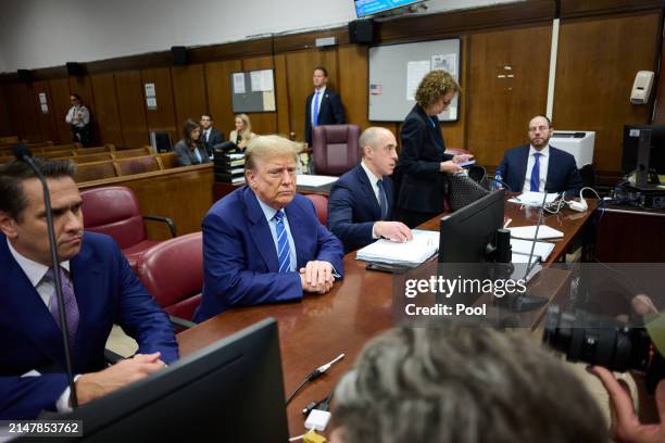 Former U.S. President Donald Trump attends jury selection with his attorneys Todd Blanche, Emil Bove and Susan Necheles on the second day of his...