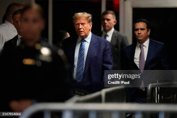 Former U.S. President Donald Trump arrives for jury selection on the second day of his trial for allegedly covering up hush money payments at...