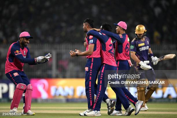Rajasthan Royals' Avesh Khan celebrates with teammates after taking the wicket of Kolkata Knight Riders' Phil Salt during the Indian Premier League...