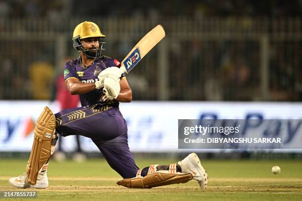 Kolkata Knight Riders' captain Shreyas Iyer watches the ball after playing a shot during the Indian Premier League Twenty20 cricket match between...