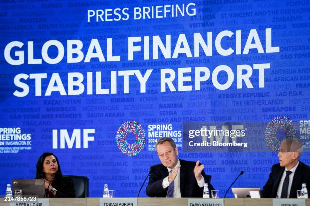 Meera Louis, communications officer at the International Monetary Fund , from left, Tobias Adrian, director of monetary and capital market at the...