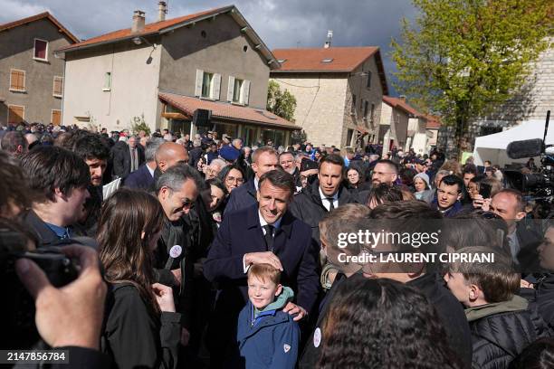 French President Emmanuel Macron meets residents, during the commemorations of the 80th anniversary of the Liberation of France in...