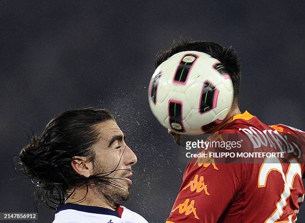 Roma's forward Marco Borriello fights for the ball with Genoa's defender Moreno Jose Chico Flores during their Serie A football match against Genoa...