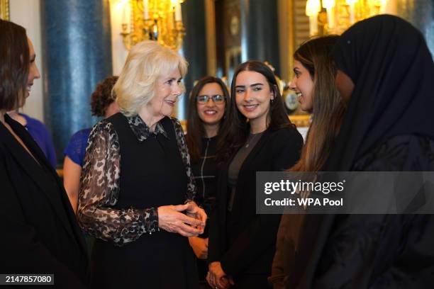 Queen Camilla, Patron of SafeLives, meets with young pioneer 'Changemakers', from the SafeLives charity at Buckingham Palace on April 16, 2024 in...