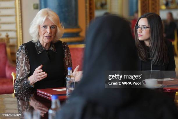 Queen Camilla, Patron of SafeLives, meets with young pioneer 'Changemakers', from the SafeLives charity at Buckingham Palace on April 16, 2024 in...