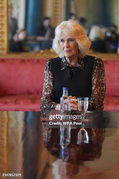 Queen Camilla, Patron of SafeLives, meets with young pioneer 'Changemakers', from the SafeLives charity at Buckingham Palace on April 16, 2024 in...