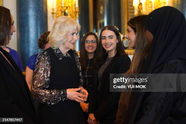 Britain's Queen Camilla , in her role as Patron of the SafeLives charity, meets with young pioneer 'Changemakers', and staff from the SafeLives...