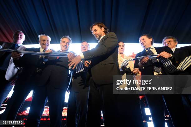 Uruguay's President Luis Lacalle Pou cuts the ribbon during the inauguration of the Central Railway in Cardal, Florida Department, Uruguay, on April...