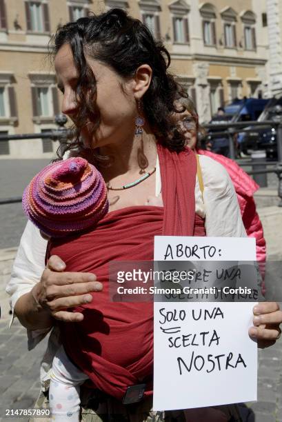 People and various left-wing parliamentarians protest in Piazza di Montecitorio against the legislative measure being voted on today in the Chamber...