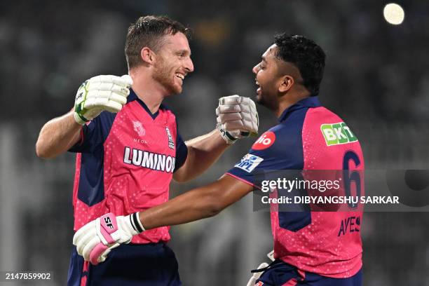 Rajasthan Royals' Jos Buttler and Avesh Khan celebrate their team's win at the end of the Indian Premier League Twenty20 cricket match between...