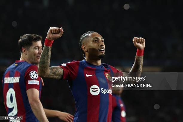 Barcelona's Brazilian forward Raphinha celebrates after scoring his team's first goal during the UEFA Champions League quarter-final second leg...