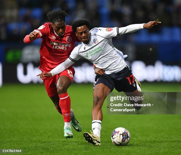 Bolton Wanderers' Nathanael Ogbeta battles with Shrewsbury Town's Tunmise Sobowale during the Sky Bet League One match between Bolton Wanderers and...