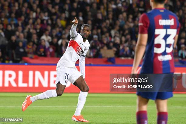 Paris Saint-Germain's French forward Ousmane Dembele celebrates after scoring his team's first goal during the UEFA Champions League quarter-final...