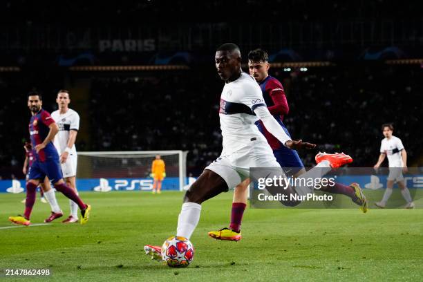 Nuno Mendes left-back of PSG and Portugal shooting to goal during the UEFA Champions League quarter-final second leg match between FC Barcelona and...