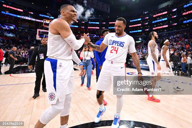 Russell Westbrook of the LA Clippers and Norman Powell of the LA Clippers celebrate after the game against the Cleveland Cavaliers on April 7, 2024...