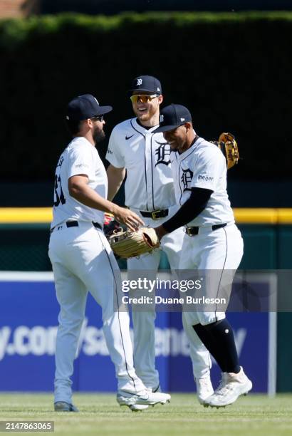 Detroit Tigers outfielders, from left, Riley Greene, Parker Meadows, and Wenceel Pérez celebrate a 4-2 win over the Texas Rangers at Comerica Park on...