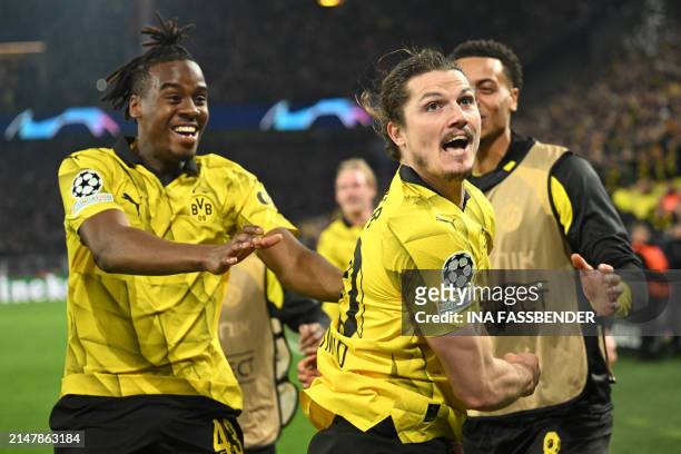 Dortmund's Austrian midfielder Marcel Sabitzer celebrates scoring his team's forth goal 4:2 with his team mates during the UEFA Champions League...