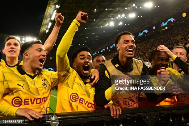 Dortmund's players celebrate scoring their forth goal 4:2 during the UEFA Champions League quarter-final second leg football match between Borussia...