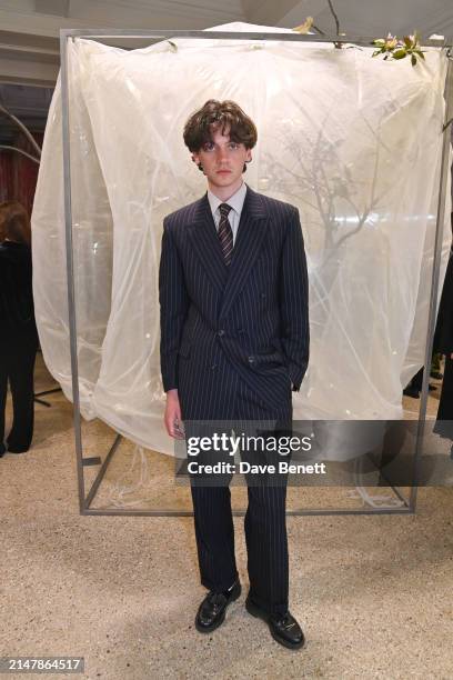 Reuben Larkin attends the rokh H&M collaboration event at Dover Street Market on April 16, 2024 in London, England.