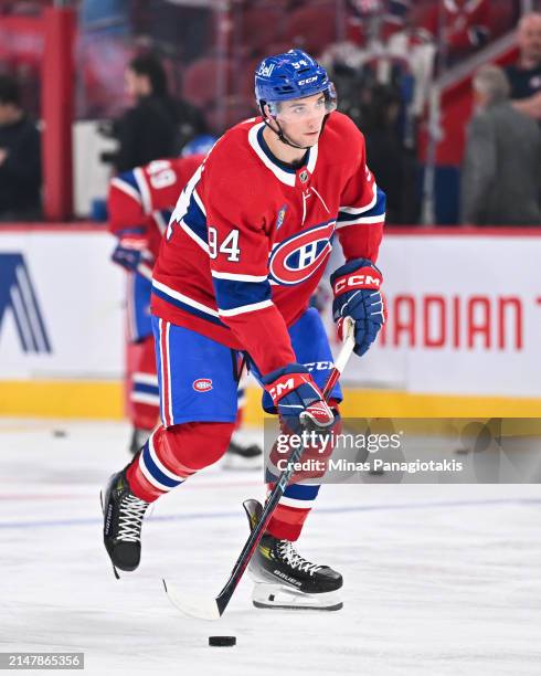 Logan Mailloux of the Montreal Canadiens skates the puck during warmups prior to his NHL debut against the Detroit Red Wings at the Bell Centre on...