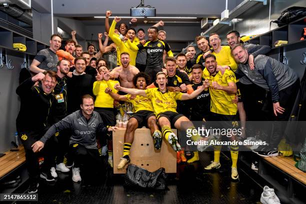 The team of Borussia Dortmund celebrates in the fitting room after winning the UEFA Champions League quarter-final second leg soccer match between...