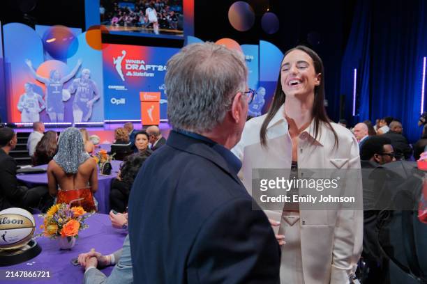 Geno Auriemma talks to Caitlin Clark during the 2024 WNBA Draft on April 15, 2024 at the Brooklyn Academy of Music in Brooklyn, New York. NOTE TO...