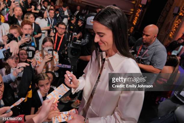 Caitlin Clark signs autographs during the 2024 WNBA Draft on April 15, 2024 at the Brooklyn Academy of Music in Brooklyn, New York. NOTE TO USER:...