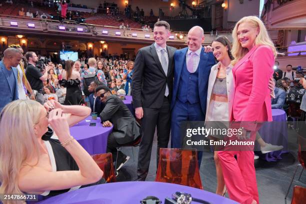 Cameron Brink takes a photo of her family with Caitlin Clark during the 2024 WNBA Draft on April 15, 2024 at the Brooklyn Academy of Music in...